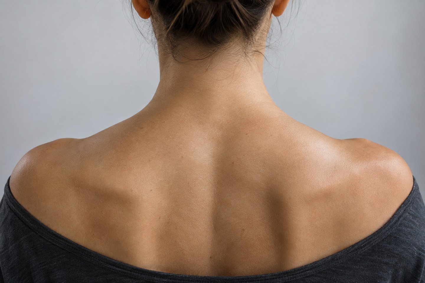 Illustrative rear view of the neck and upper trapezius area